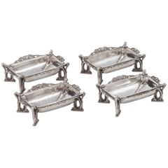 Set of Four Arts & Crafts Silver Dishes