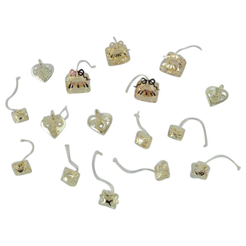 Royal Copenhagen "Royal Christmas". Set of 16 brass Christmas ornaments.