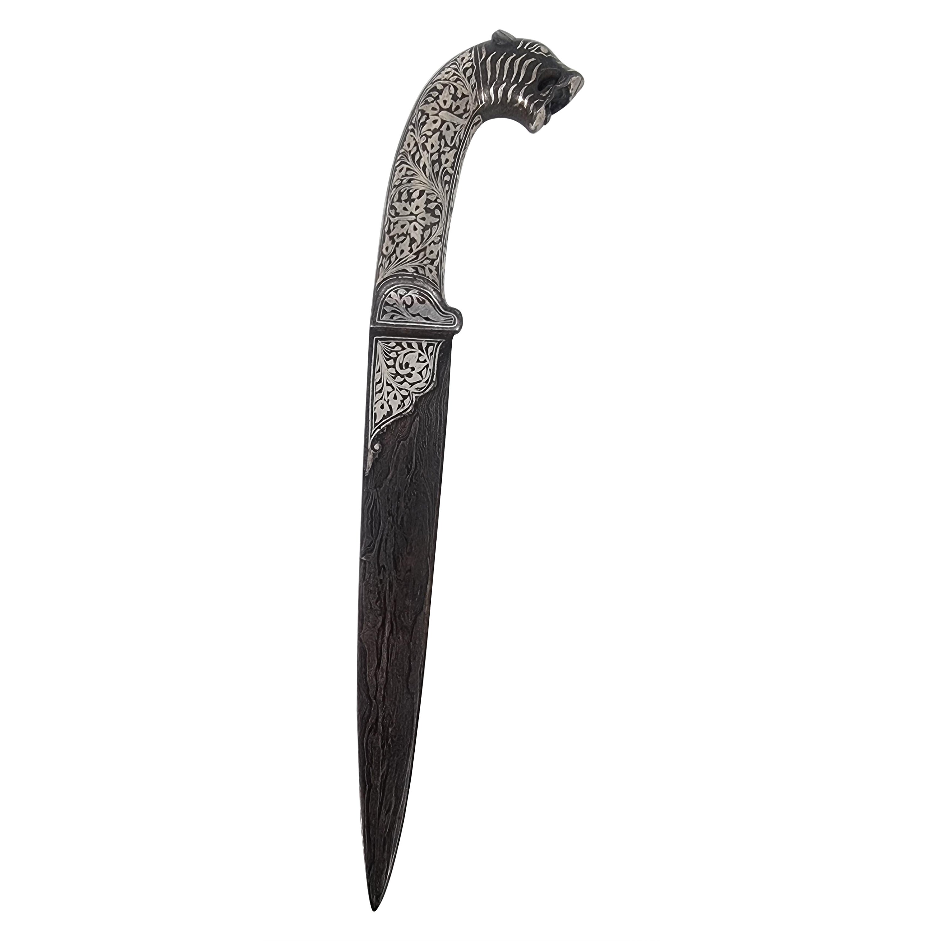 A 19th century Indian silver inlaid dagger with a Damascus steel blade, C 1870 For Sale