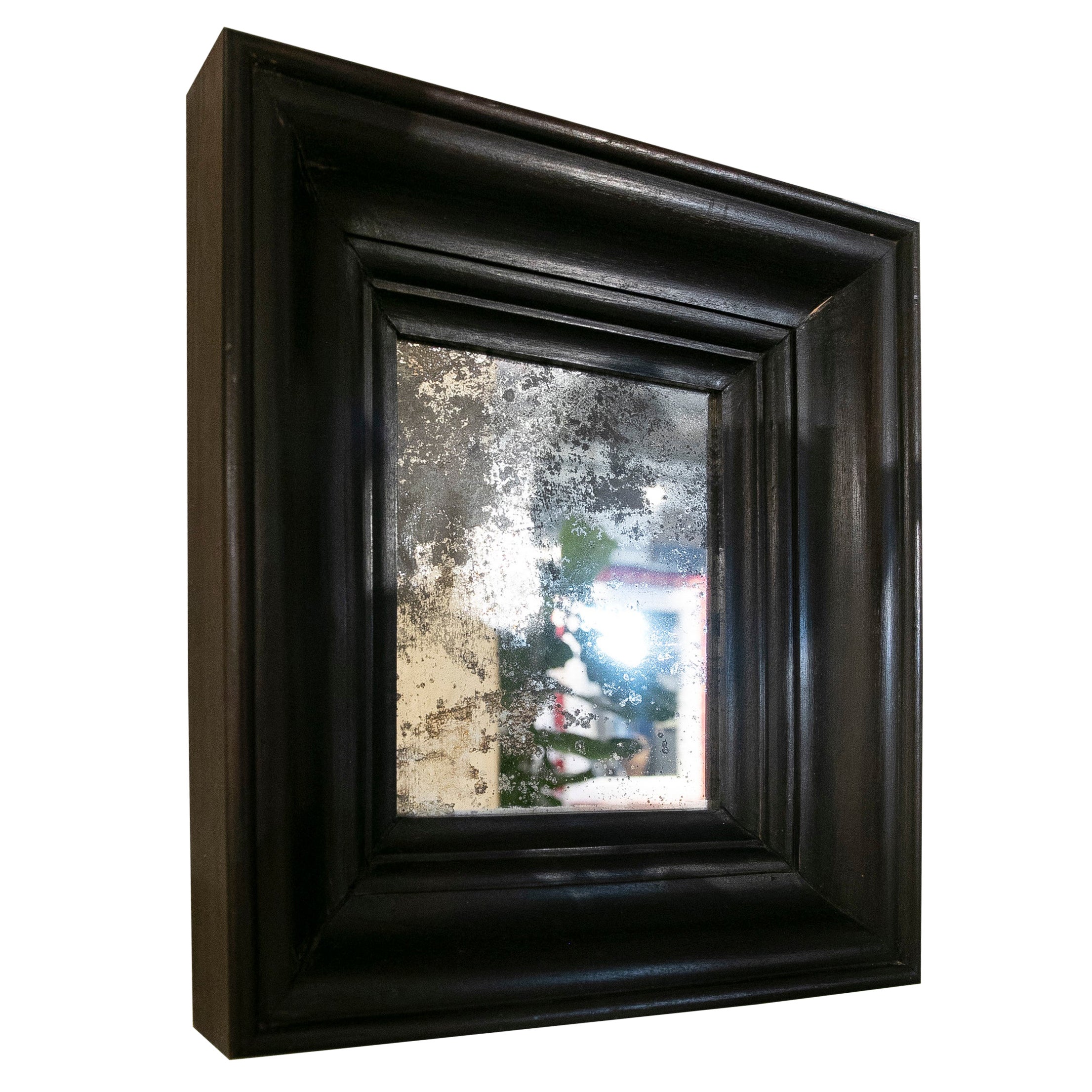 Dunkler Holzspiegel mit antikisiertem Spiegel im Angebot