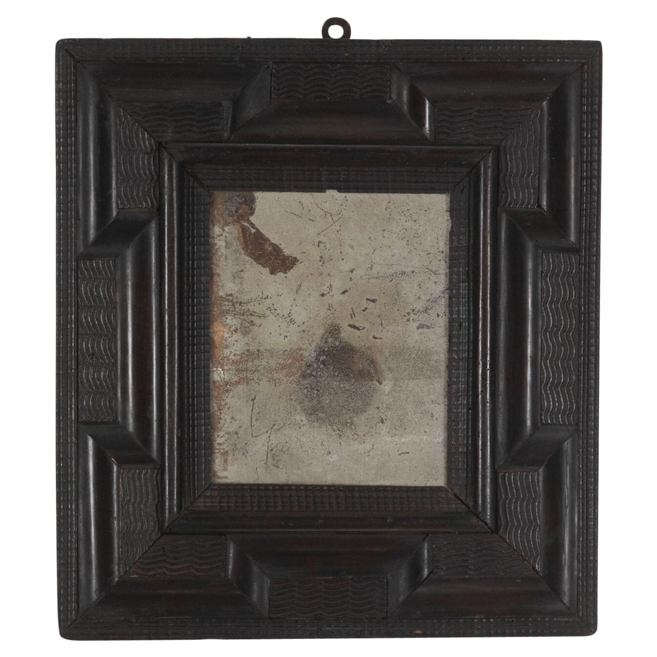 17th Century Italian Ebonised Ripple Mirror For Sale
