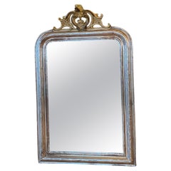 Antique 19th century silver leaf gilt French mirror with a crest