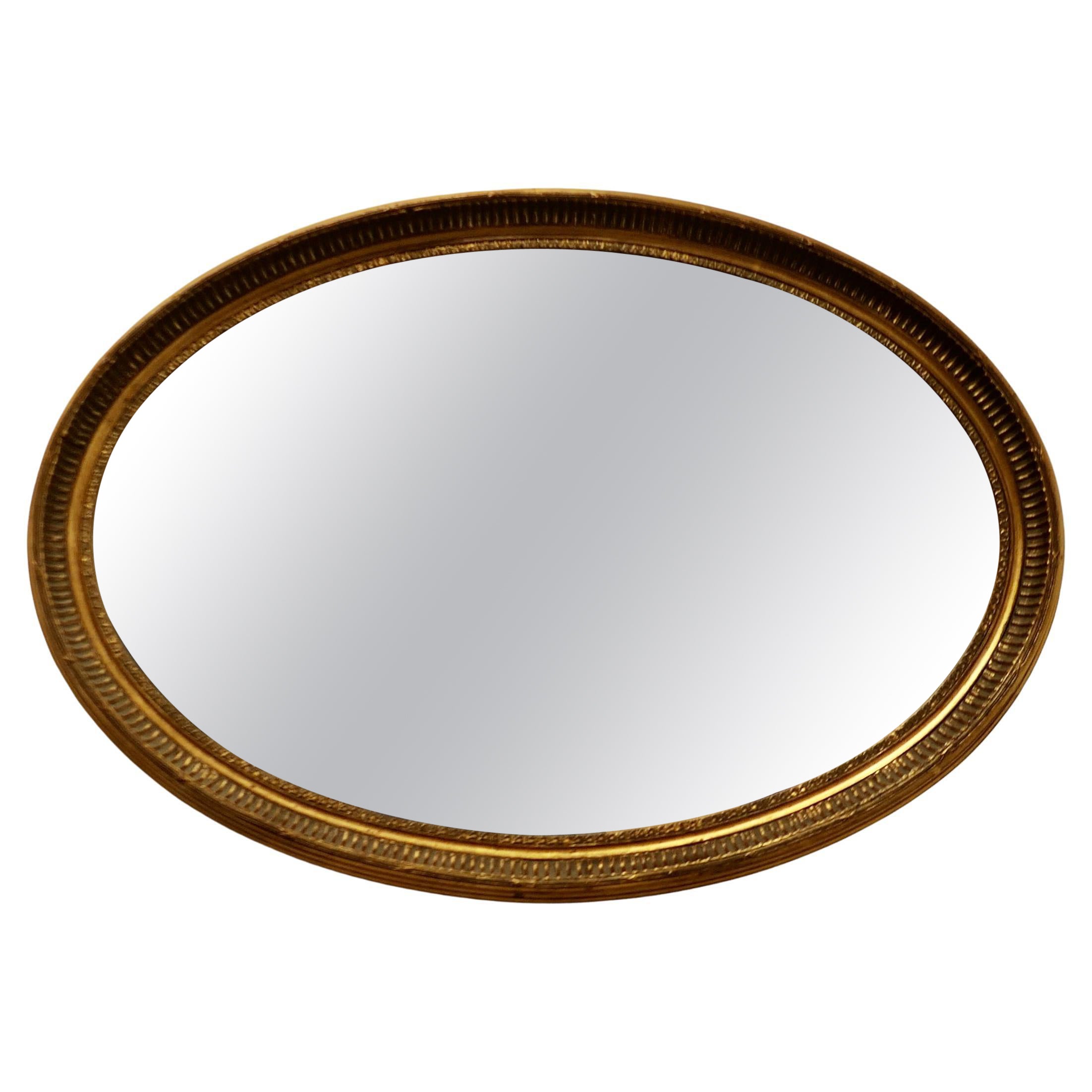 Large Gilt Oval Mirror    For Sale
