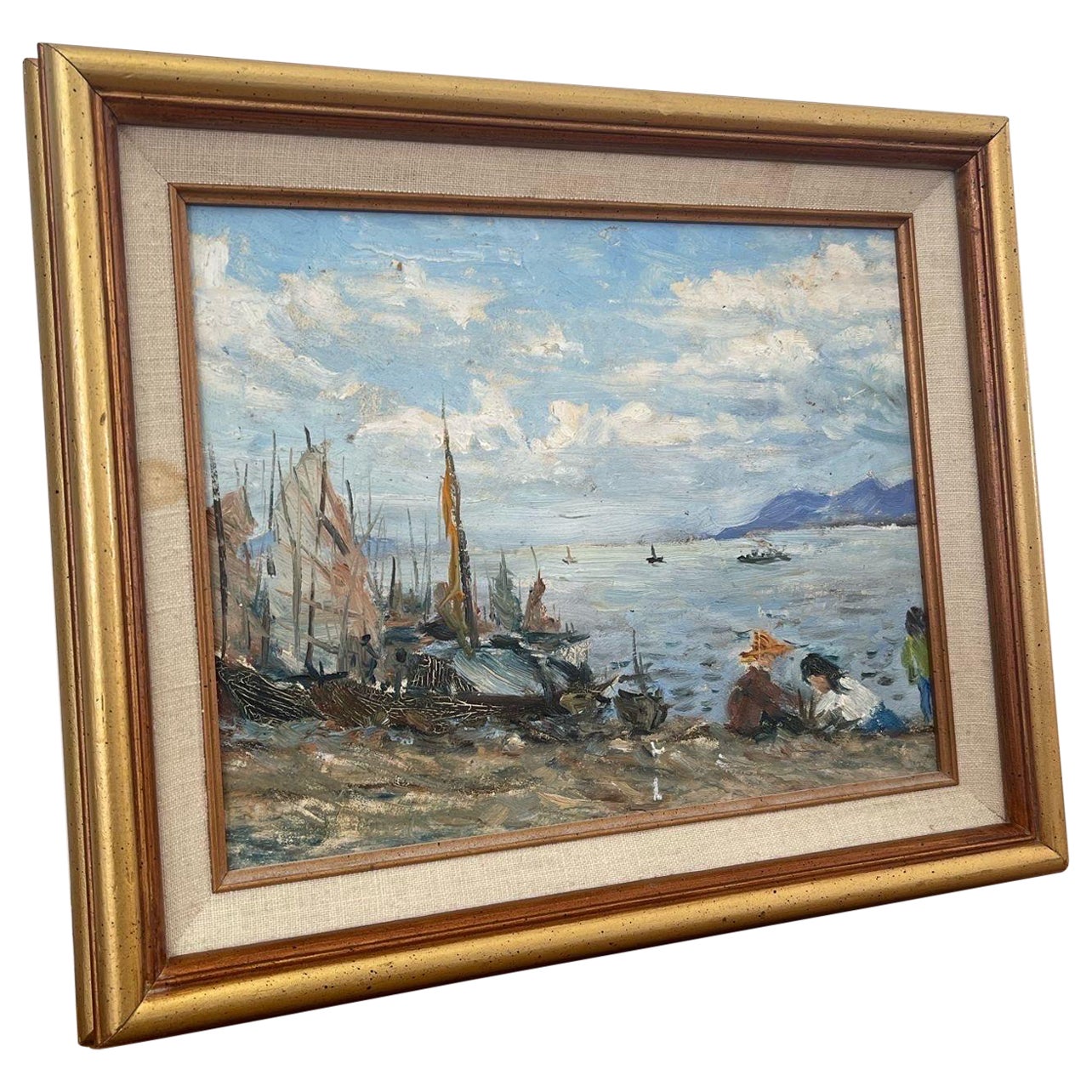 Peinture vintage encadrée d'une scène de plage.