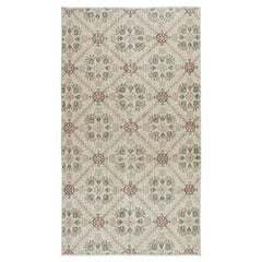 4x6.8 Ft Handknotted Vintage Rug with Beige Background and Green Floral Pattern