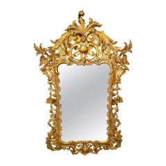 Miroir Chippendale anglais en bois sculpté et doré