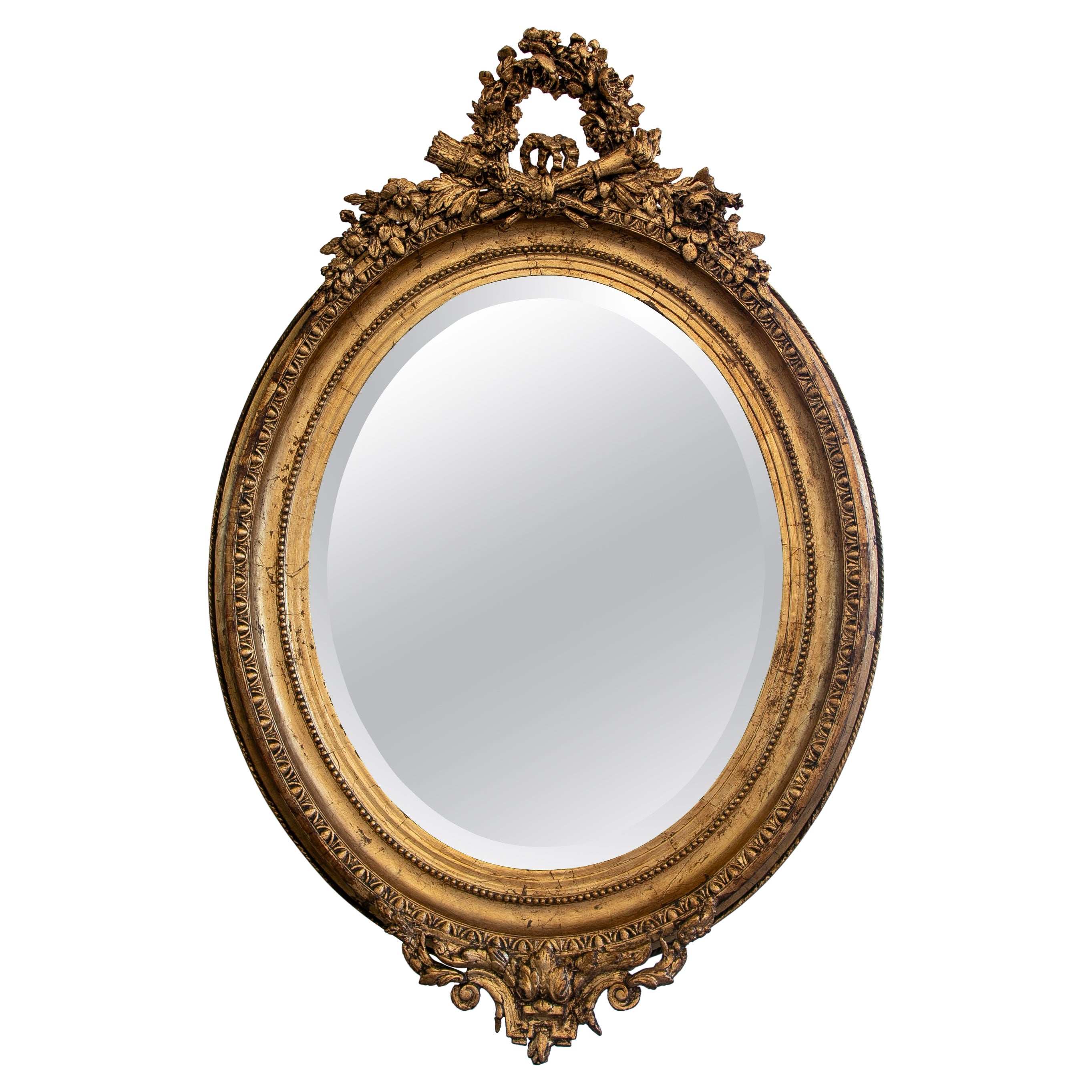 French Oval Mirror with Gold Tones and Flower Garland Coping