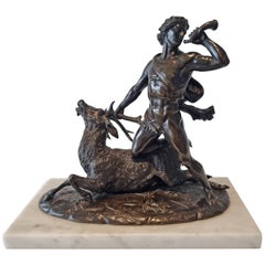 Antique Patinated Bronze model of a huntsman and a stag by Holme Cardwell