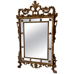 Grand miroir rocococo italien sculpté et doré