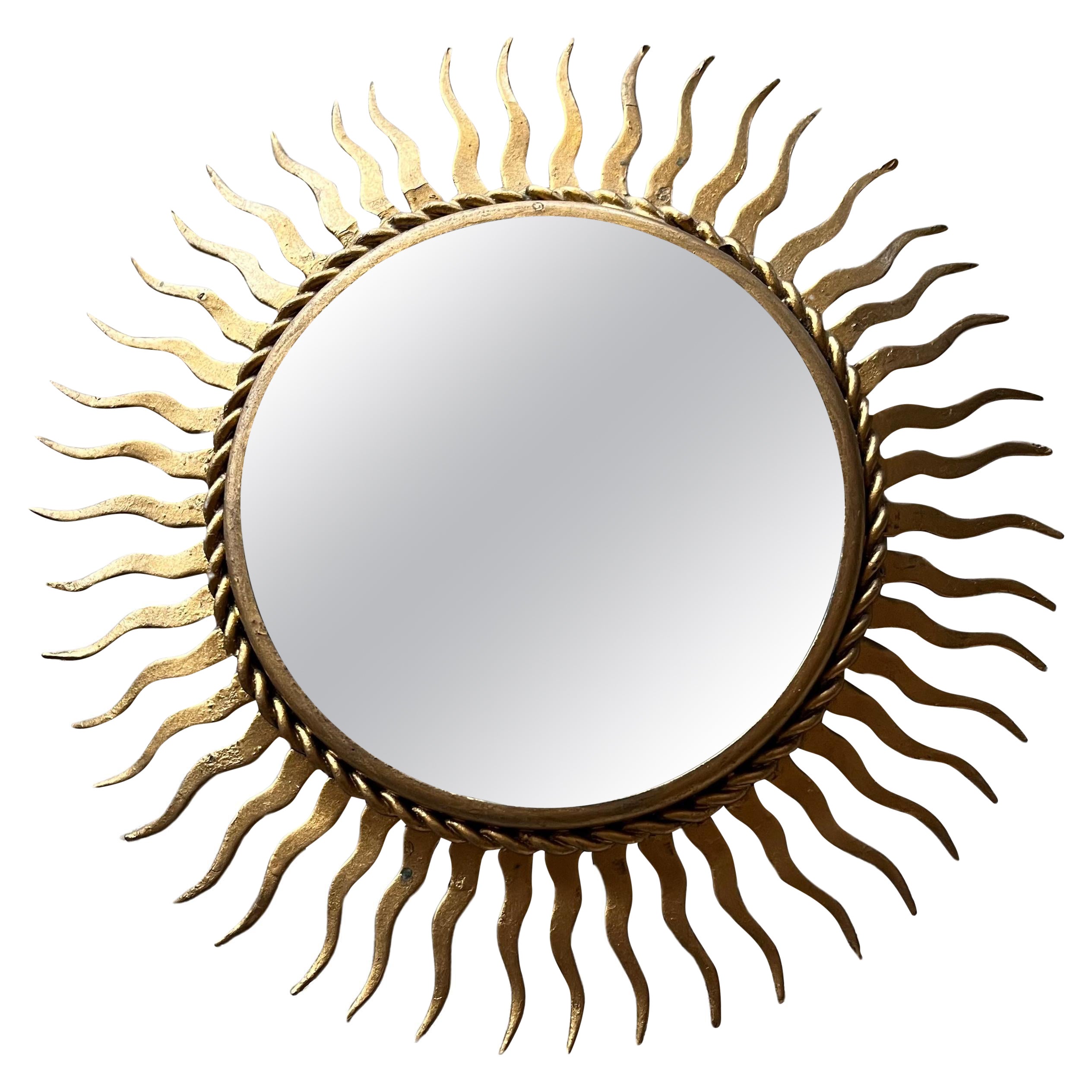 Small French gilt metal starburst mirror For Sale