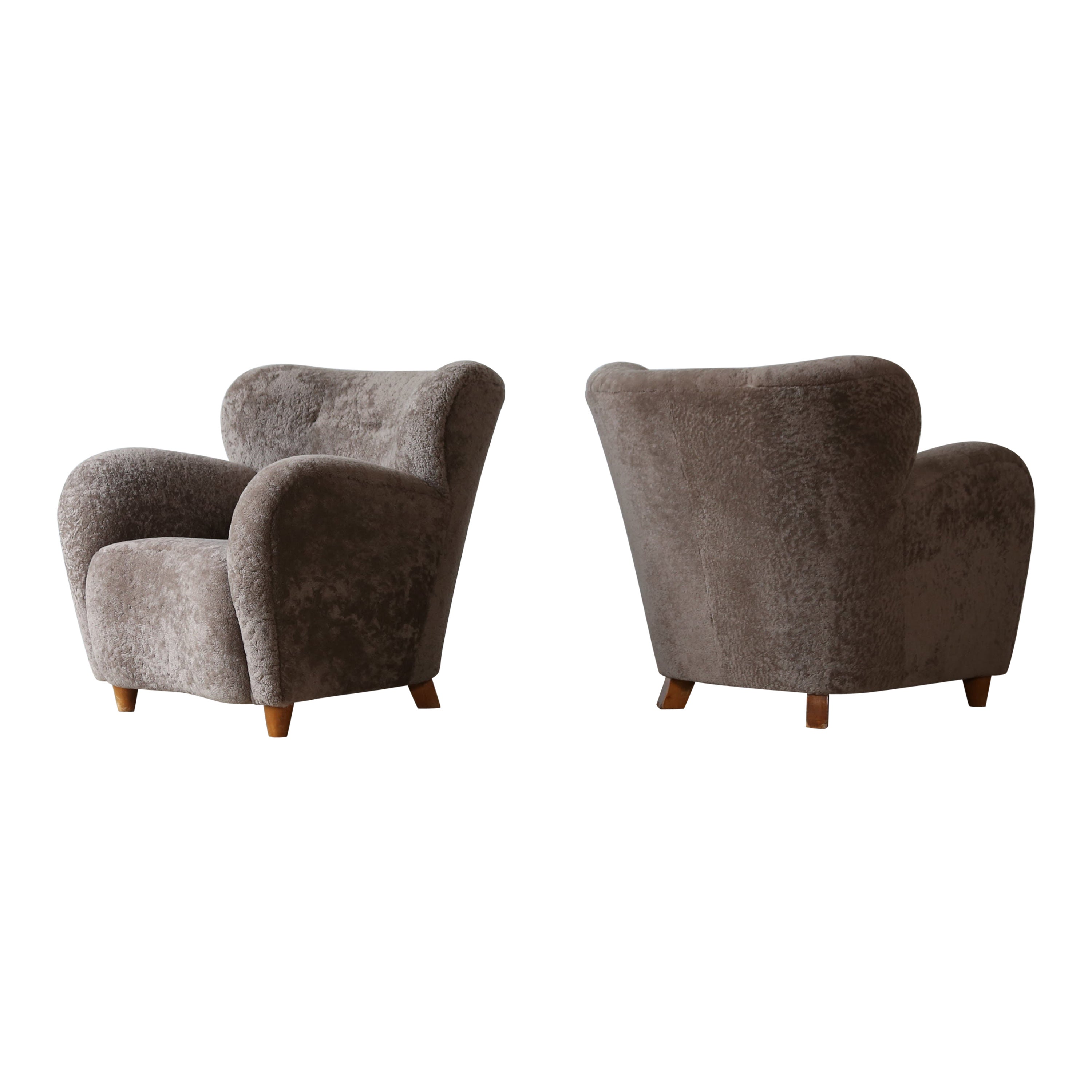 Pair of Lounge Chairs, Denmark, 1950s, Newly Upholstered in Sheepskin For Sale