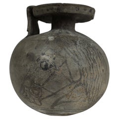 Used Greek aryballos depicting a horse head