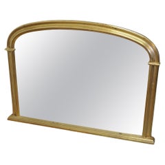 Miroir trumeau de style victorien arqué en or  Un joli miroir de cheminée   