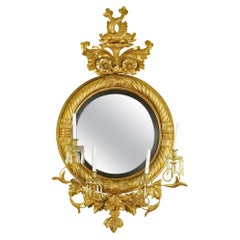 A Fine Regency Giltwood and Ebonised Girandole Mirror