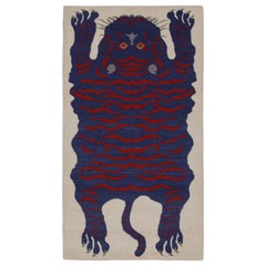 Rug & Kilim’s Tiger-Skin Rug in White with Blue & Red Pictorial