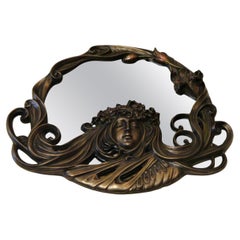 Spectaculaire miroir orné sculpté à la main et peint en bronze de style Art déco, rare