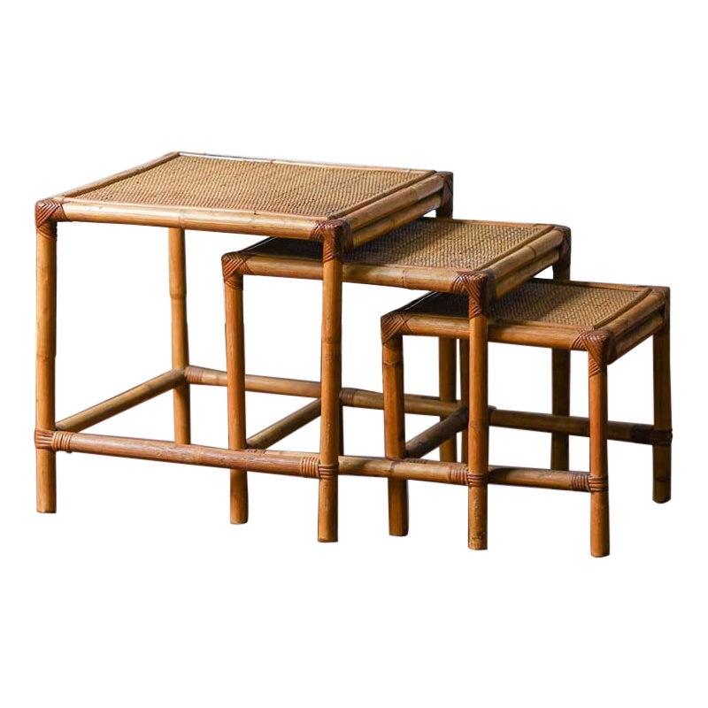 Set of three stackable rattan tables 1980