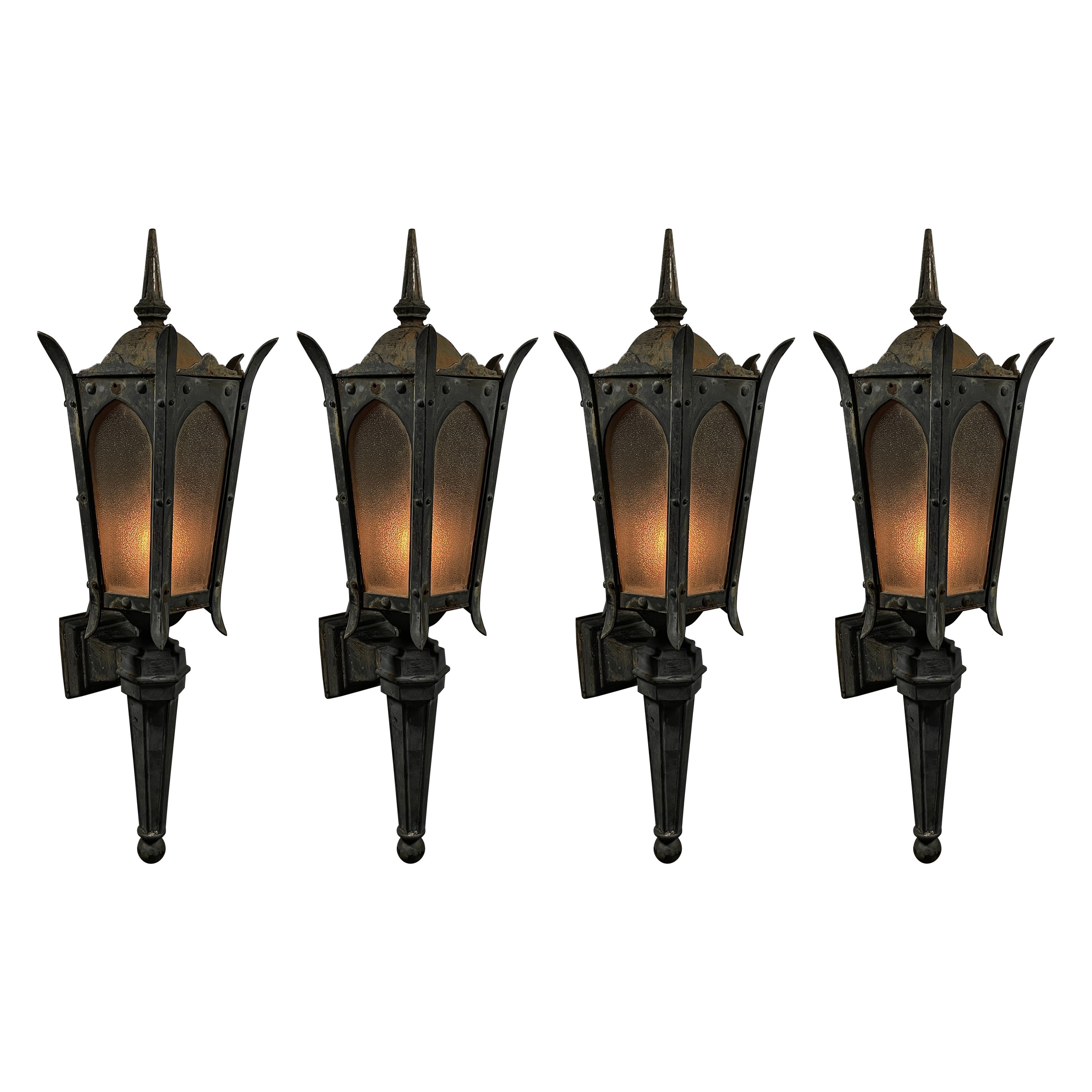 1910 group of four exterior cast iron lantern sconce lights For Sale