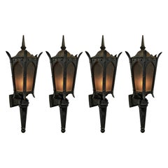 1910 group of four exterior cast iron lantern sconce lights