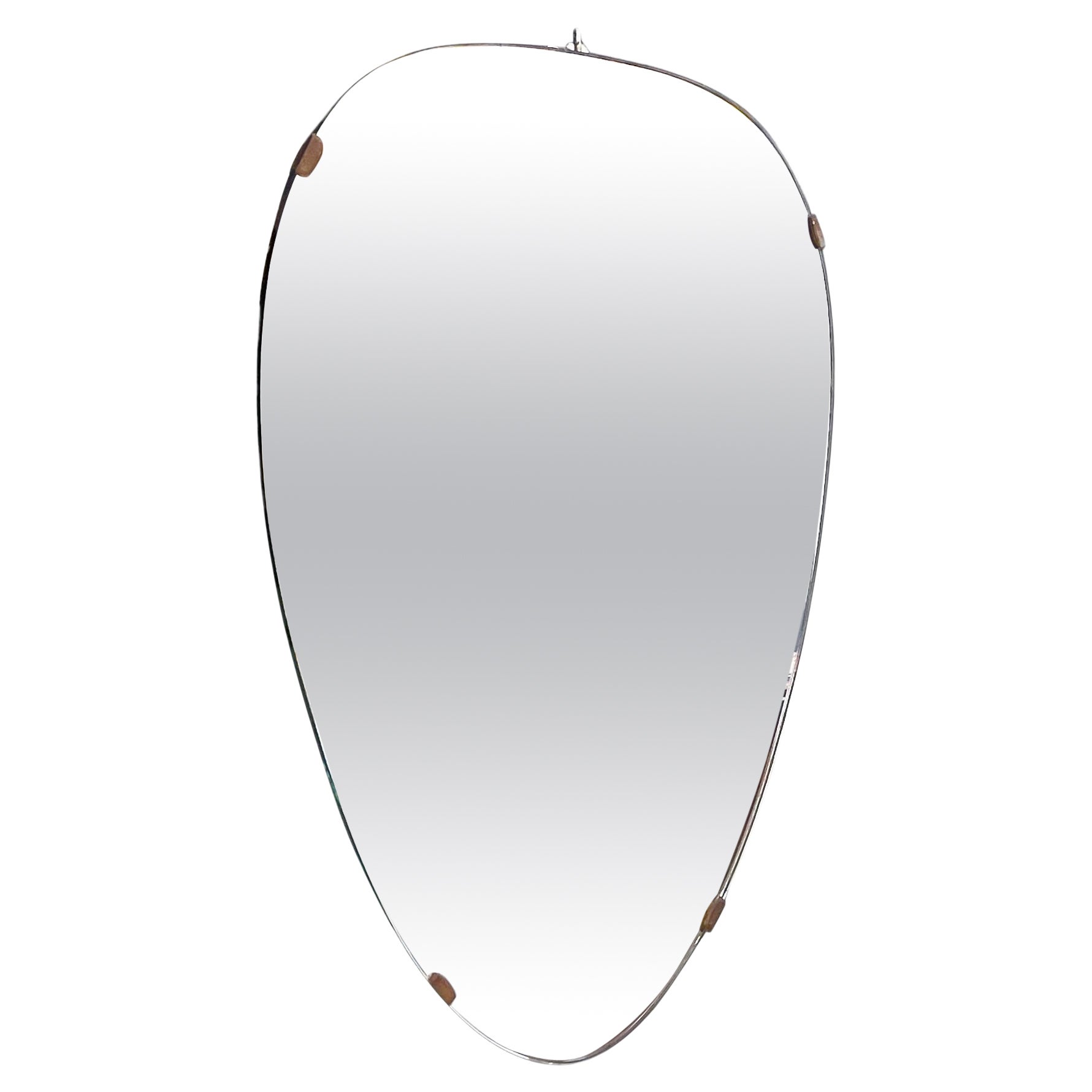 Italian mid-century modern Shield-shape wall mirror with brass details, 1960s For Sale