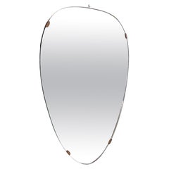 Used Italian mid-century modern Shield-shape wall mirror with brass details, 1960s