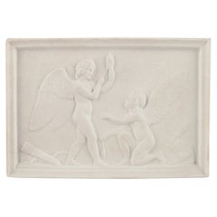 Antique Royal Copenhagen. Amor and Hymen spins the thread of life.  Biscuit relief after