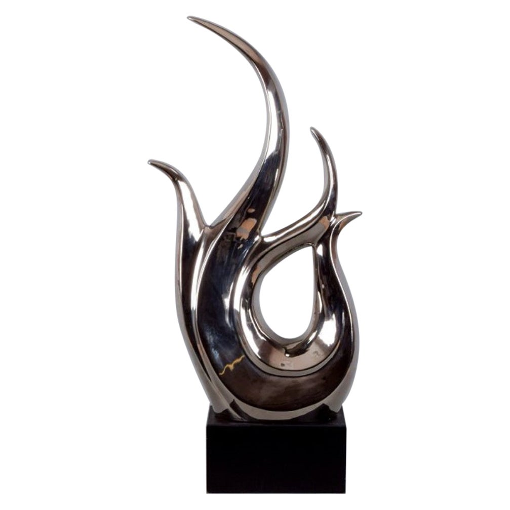 Monumental sculpture in double-patinated metal, wooden base. 1980s.  For Sale