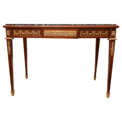 A fine 19th c French Louis XVI center table with fine gilt bronze mounts by Kahn