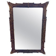 Grand miroir en faux bambou doré