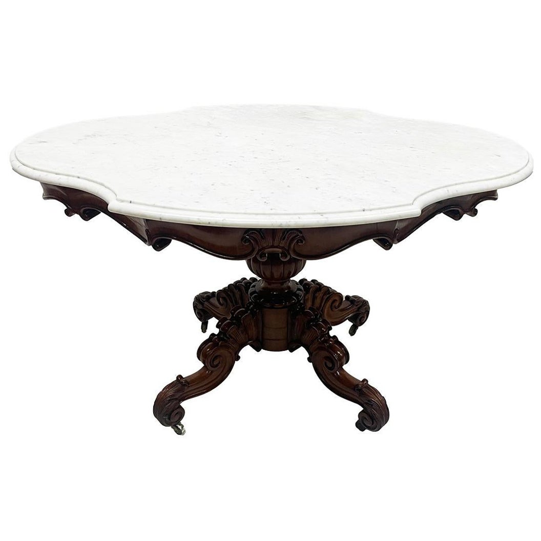 A 19th Century mahogany table with a cartouche-shaped marble top, ca 1840 For Sale