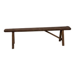 Antique French farm bench in solid oak (1950s)