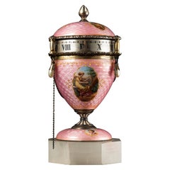 Used Egg-shaped clock with enamel decorations.