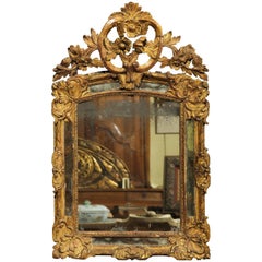 Early 18th Century French Giltwood Mirror with Flower Carving