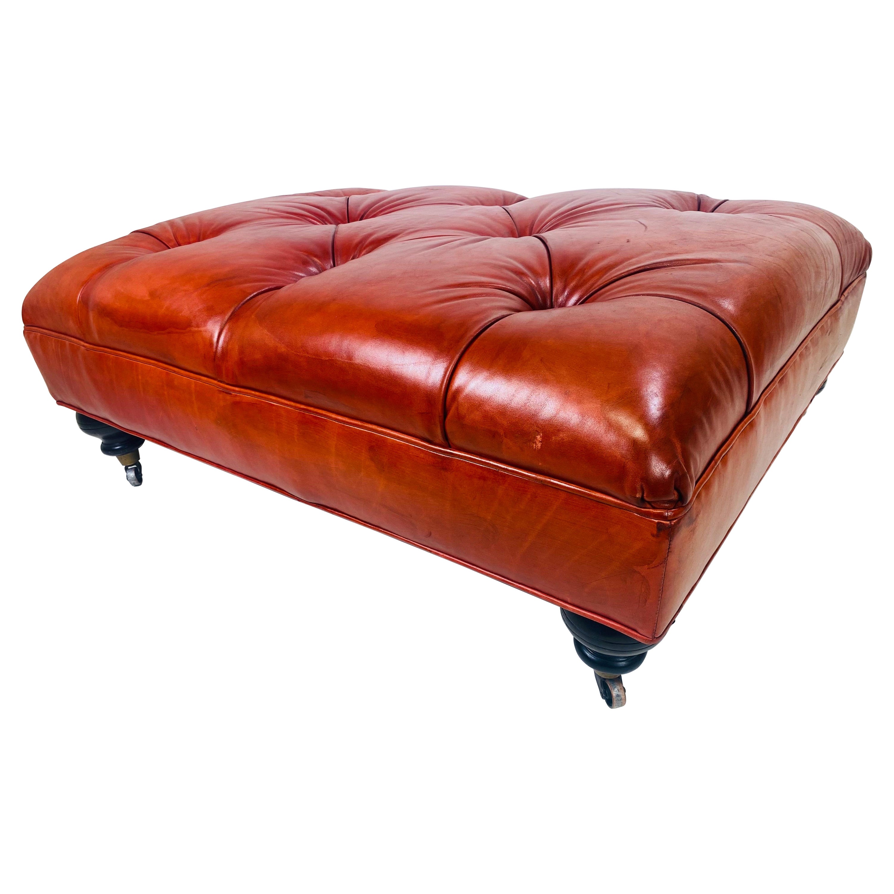 Vintage English traditional style tufted leather ottoman. For Sale