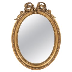 Antique Mirror francese dell'inizio del XX secolo, dorato, con fiocco ovale e legato a nastro