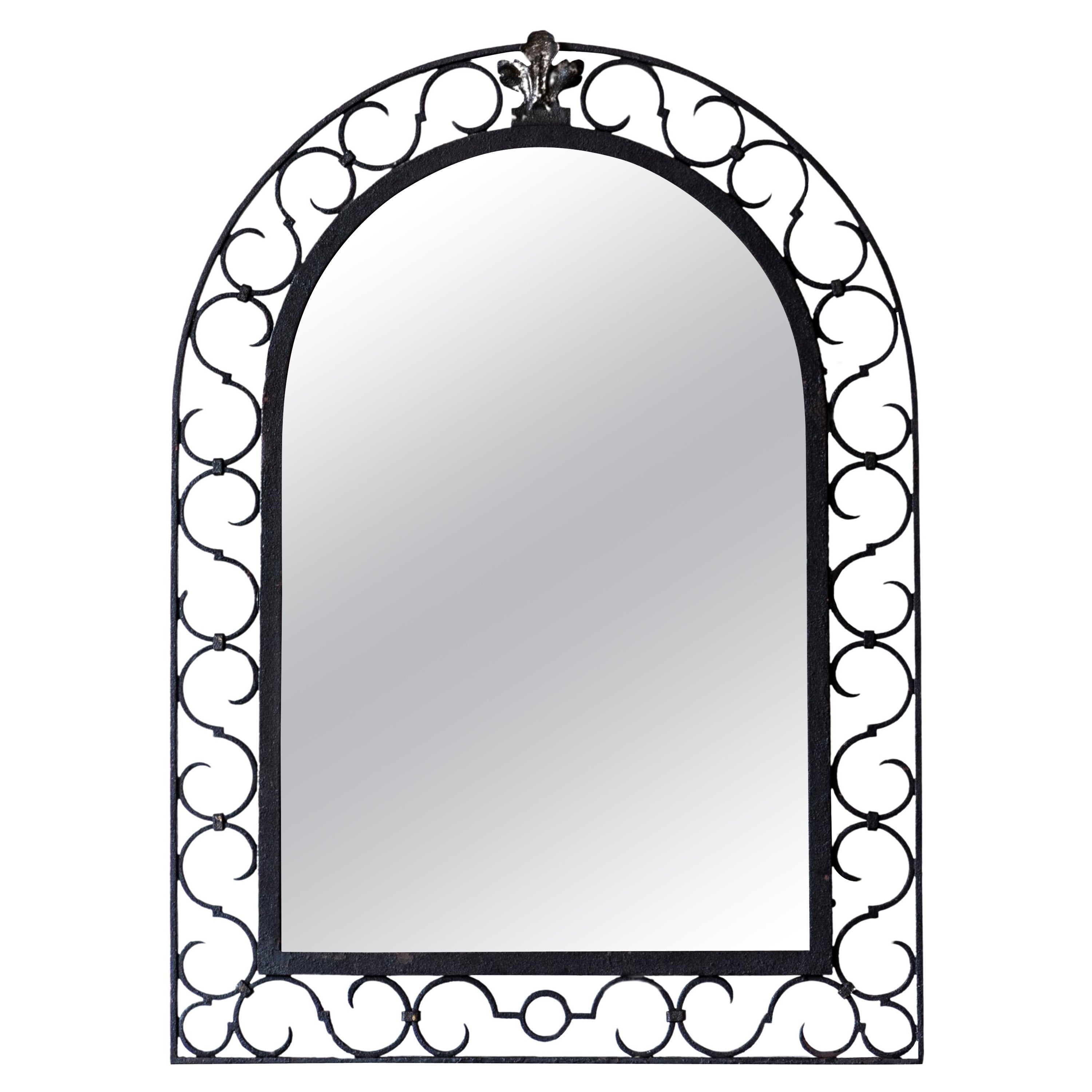 French Iron Arching Mirror with Openwork S-Scroll Motifs and Foliage Crest
