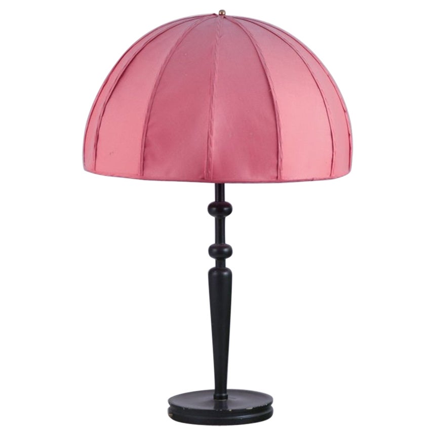 Josef Frank for Svenskt Tenn, Sweden.  Large table lamp with pink fabric shade.