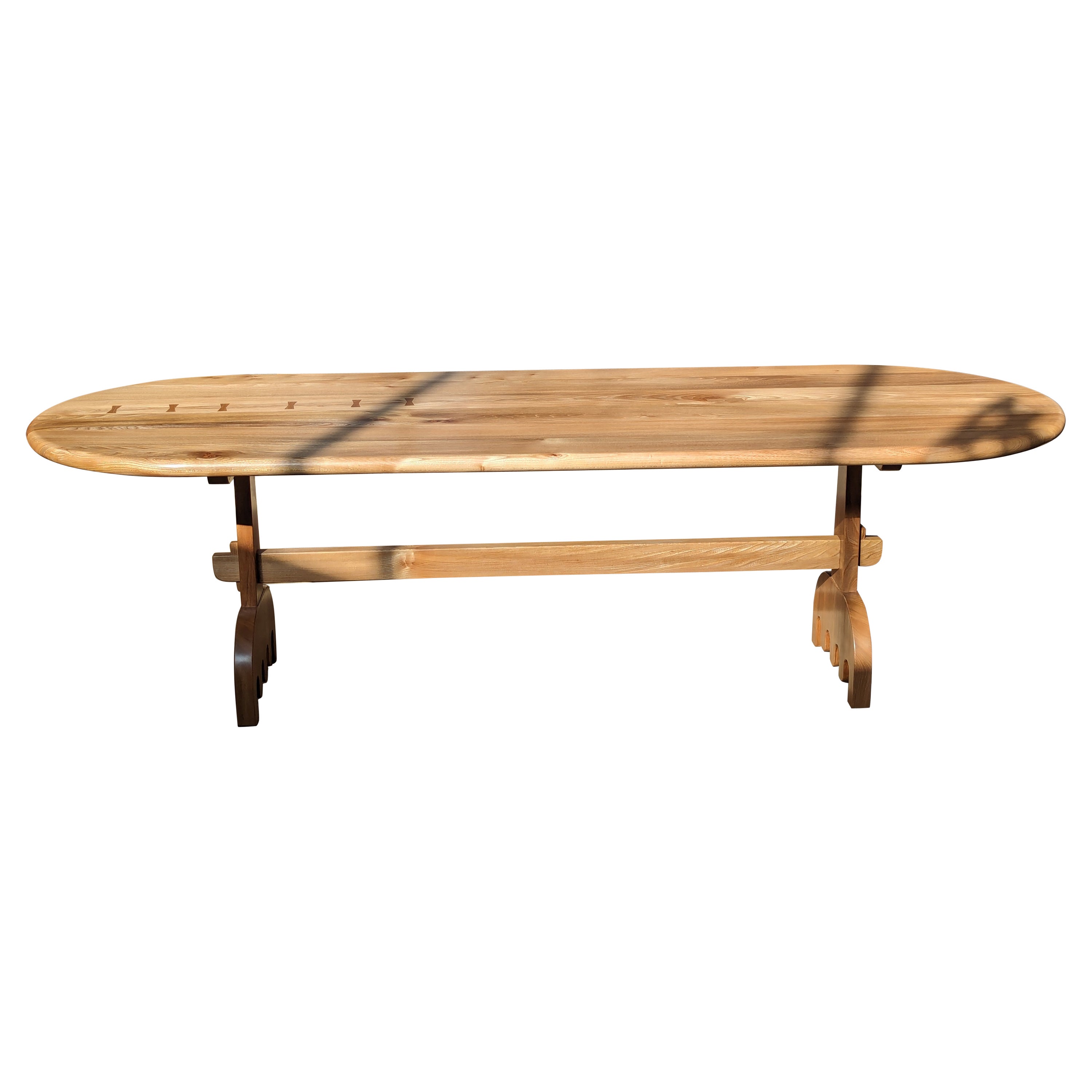 Solid Scottish Elm dining table with wedged mortice and tenon joints on the legs and wiggly feet. Based on traditional construction, with a chunkier and playful organic modern twist. Seats approximately 8-10 people.

This large table is made from