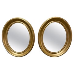 Paire de miroirs italiens ovales dorés vintage