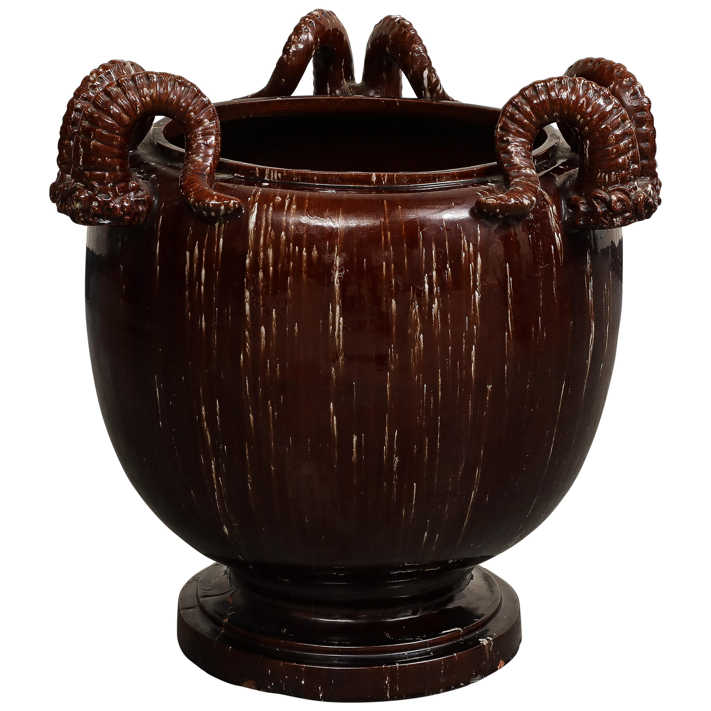 Burgundy Glazed Chinese Pottery Jardiniere with Ram's Horns For Sale
