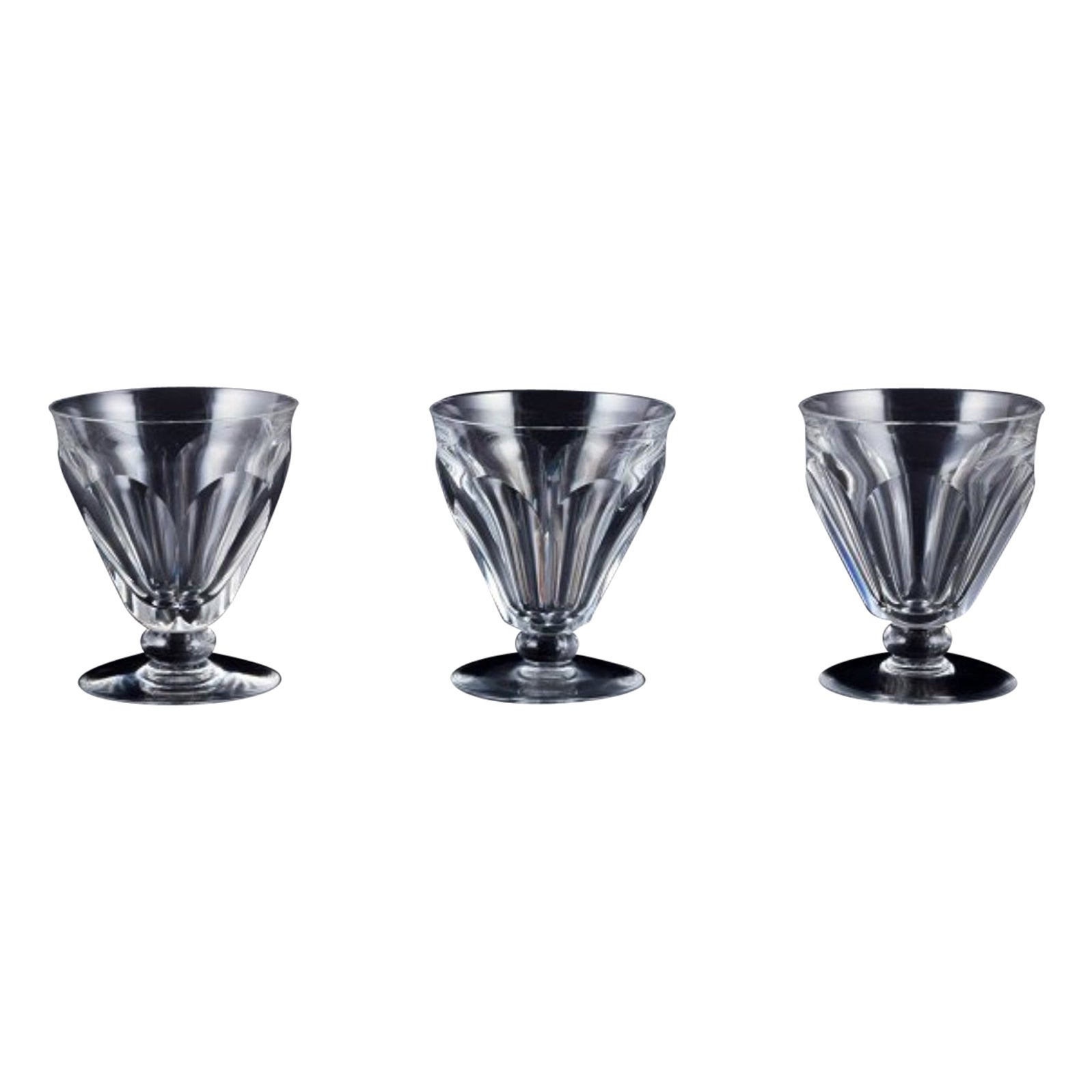 Baccarat, France. Set of three Art Deco red wine glasses in crystal glass