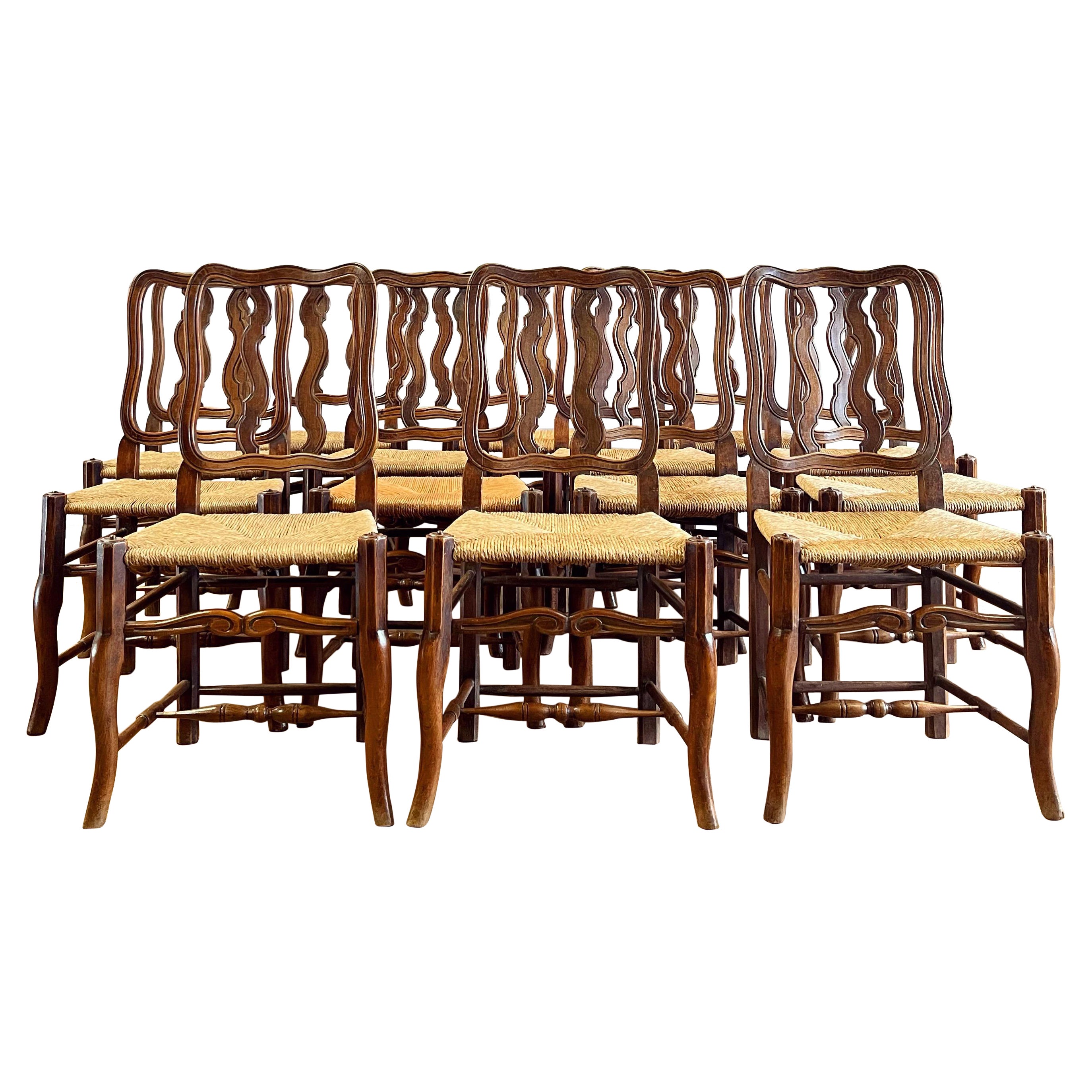 Set of Fourteen Early Twentieth Century French Vernacular Dining Chairs For Sale