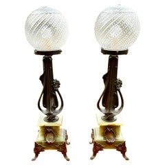 A Pair of Antique Art Nouveau Onyx and Metal Lamps