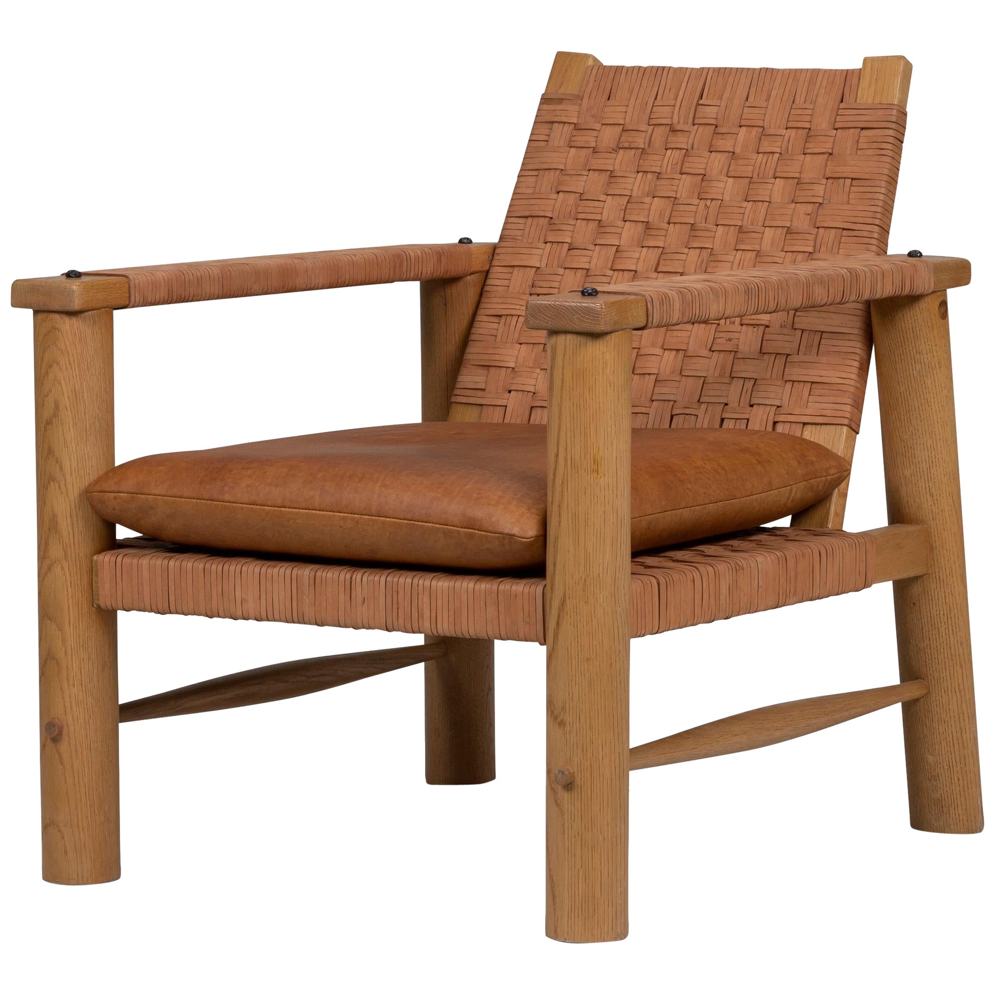 Rustikaler französischer Lounge-Sessel aus gewebtem Leder im Angebot