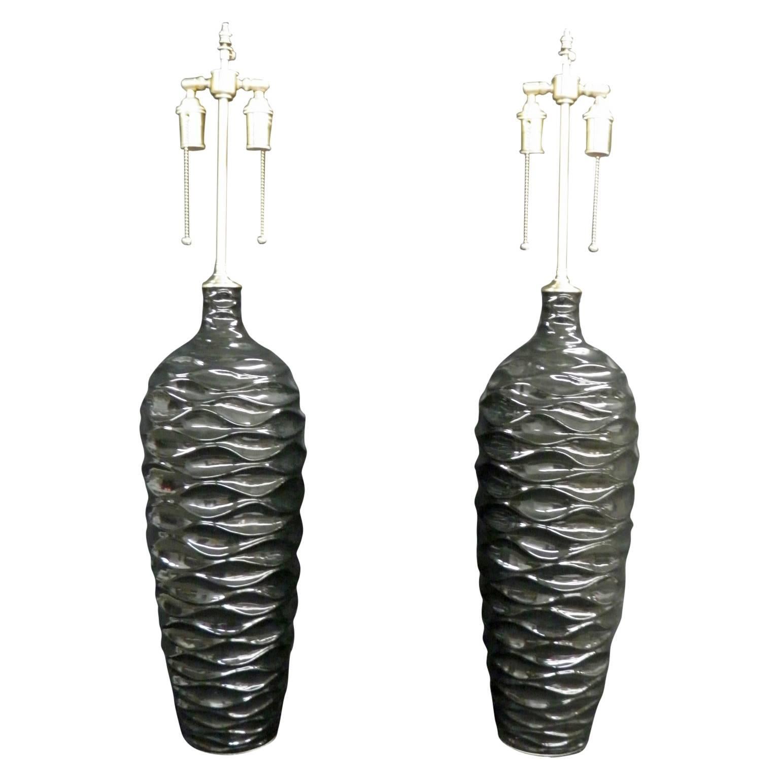 Majestic Pair of "Wave" Pattern Black, Glazed Vessels with Lamp Application For Sale