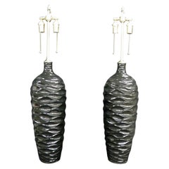 Vintage Majestic Pair of "Wave" Pattern Black, Glazed Vessels with Lamp Application