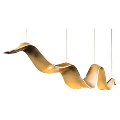 New Suspension Lamp in Resin Finished in Pale Gold Color