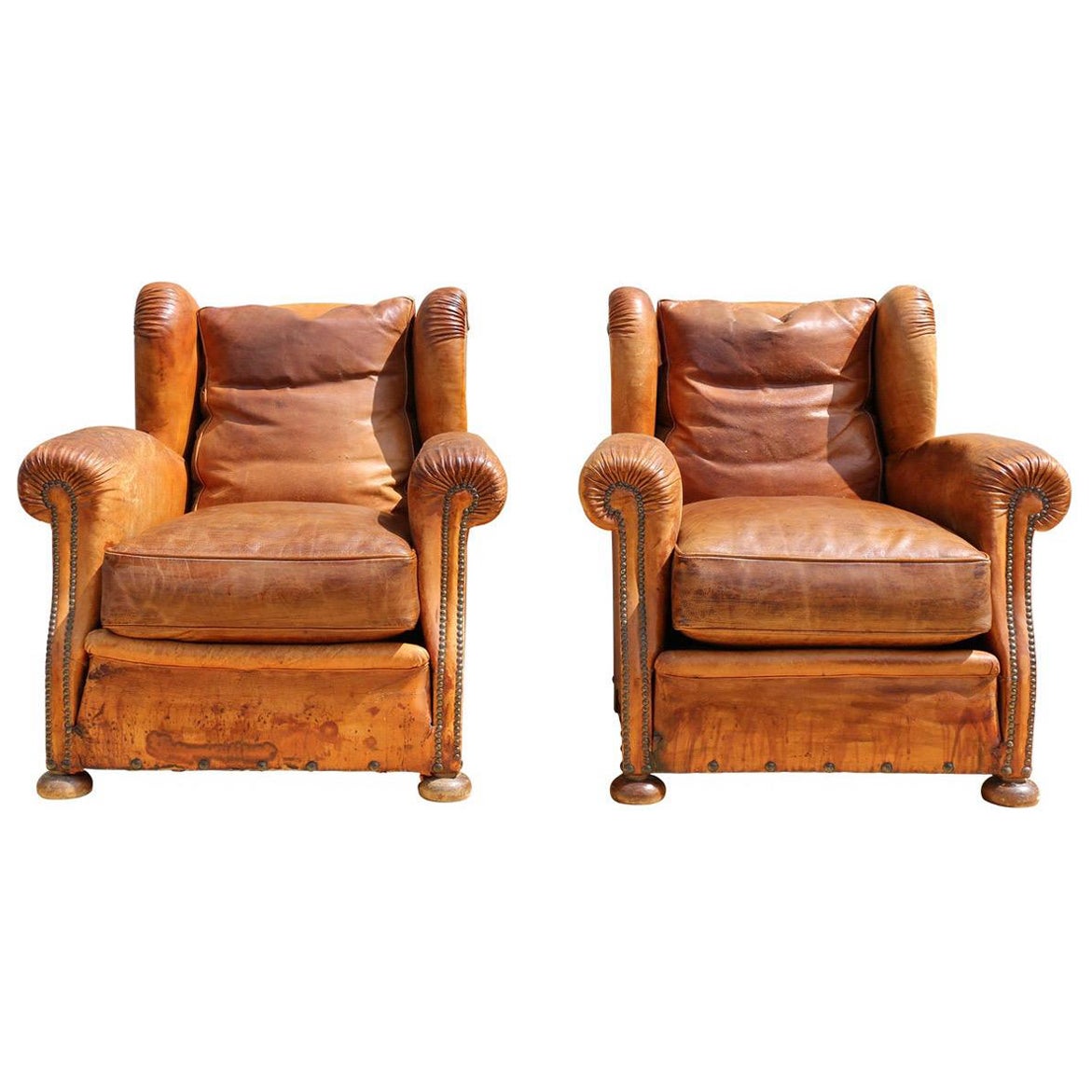 Antique Pair of French Art Deco Distressed Brown Leather Wingback Lounge Chairs For Sale