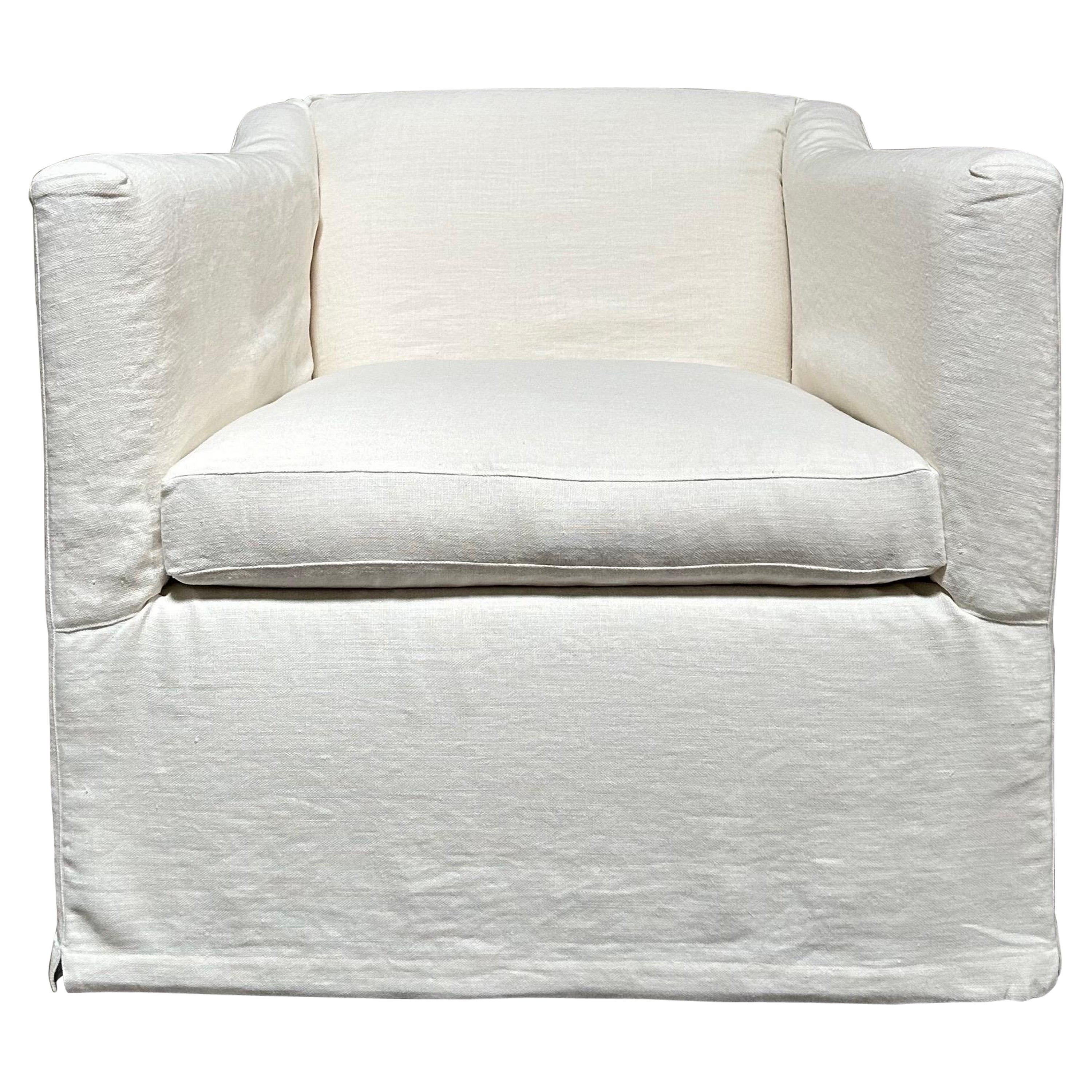 slip cover swivel chair upholstered in white belgian linen