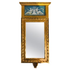Miroir en bois doré et décoré de bleu
